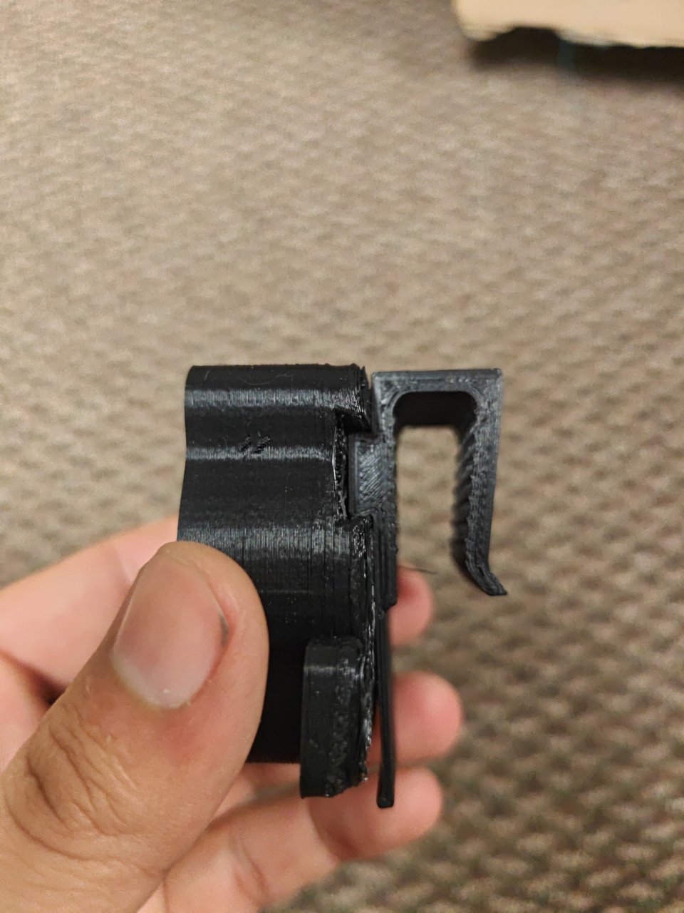 Side view of the holder with a clip slid into the back